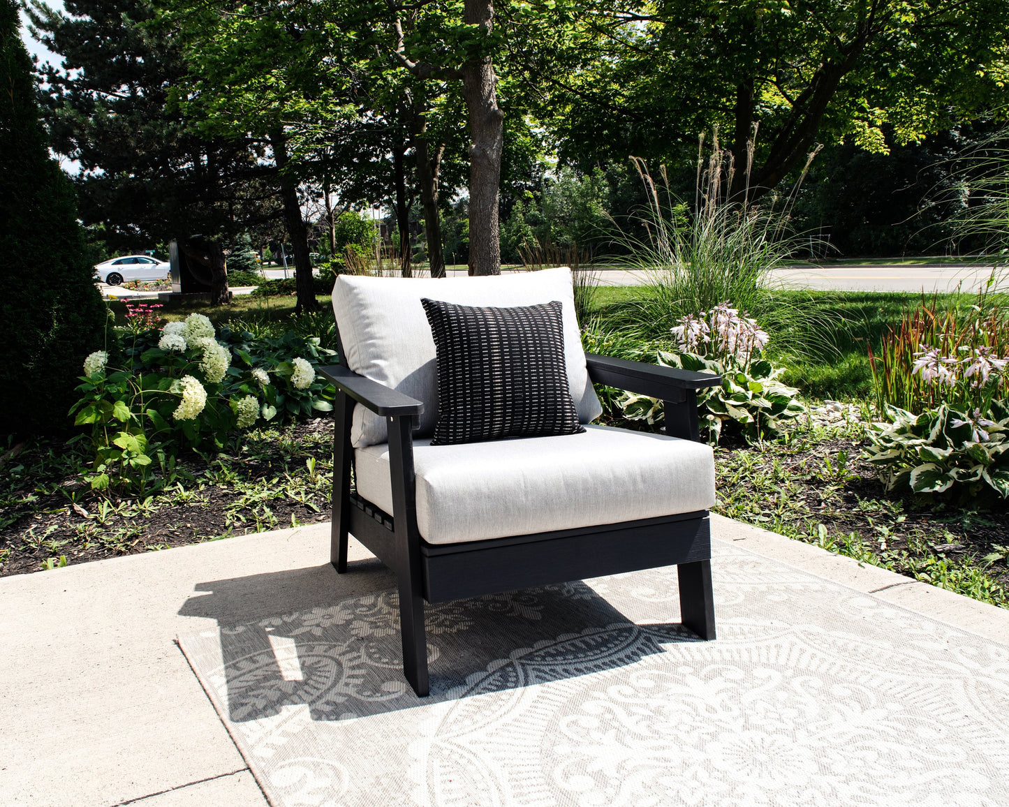 Hazelnut Black Polymer Lounge Chair with Sunbrella® Cushion