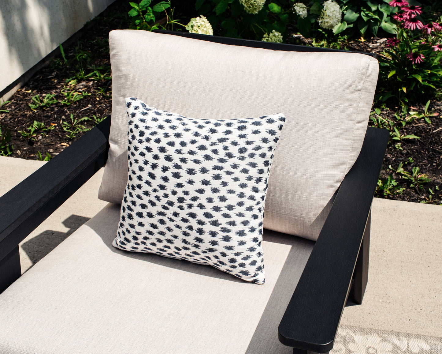 Hazelnut Black Polymer Lounge Chair with Sunbrella® Cushion